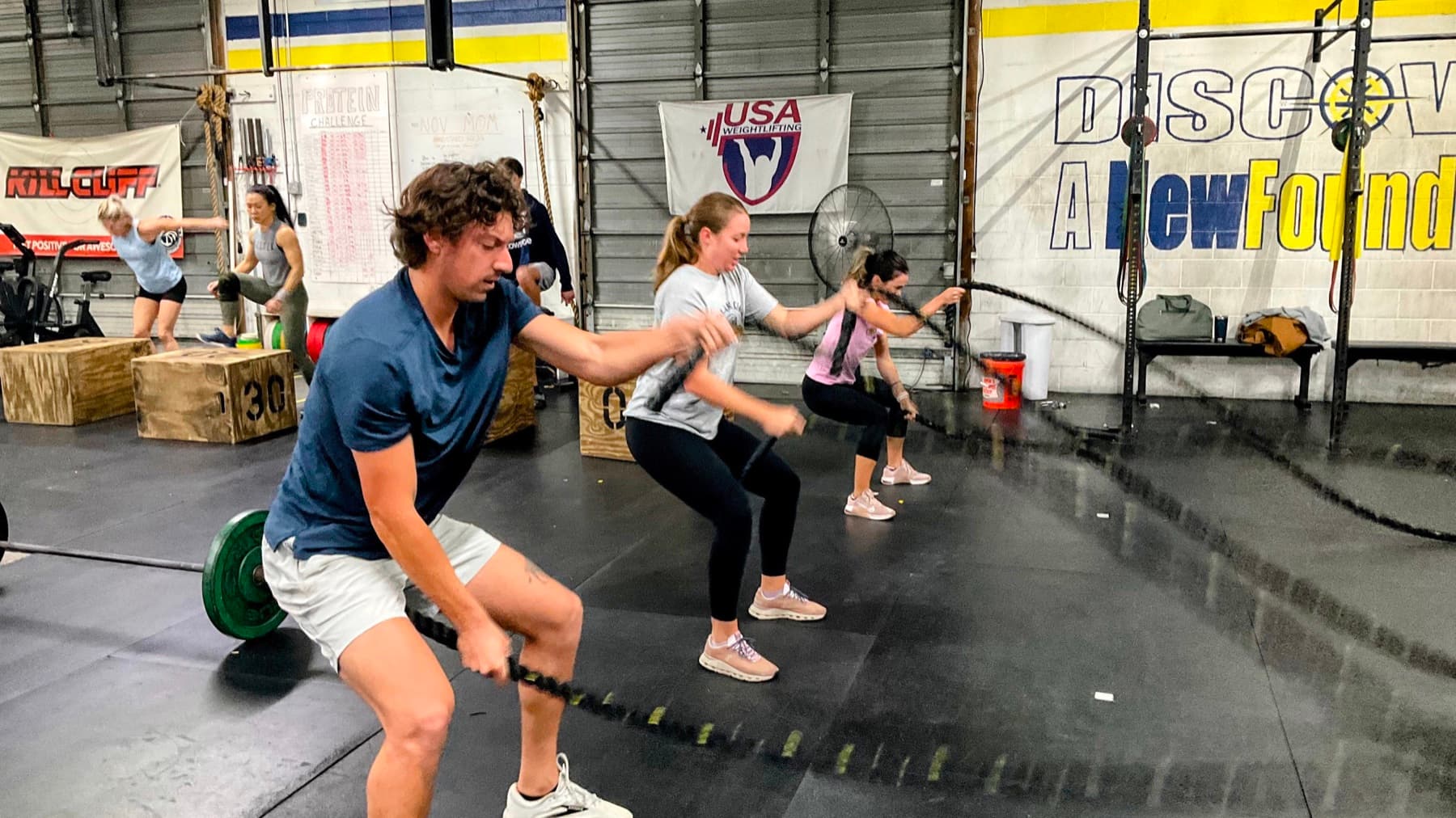 CrossFit NewFound athlete training with battle ropes