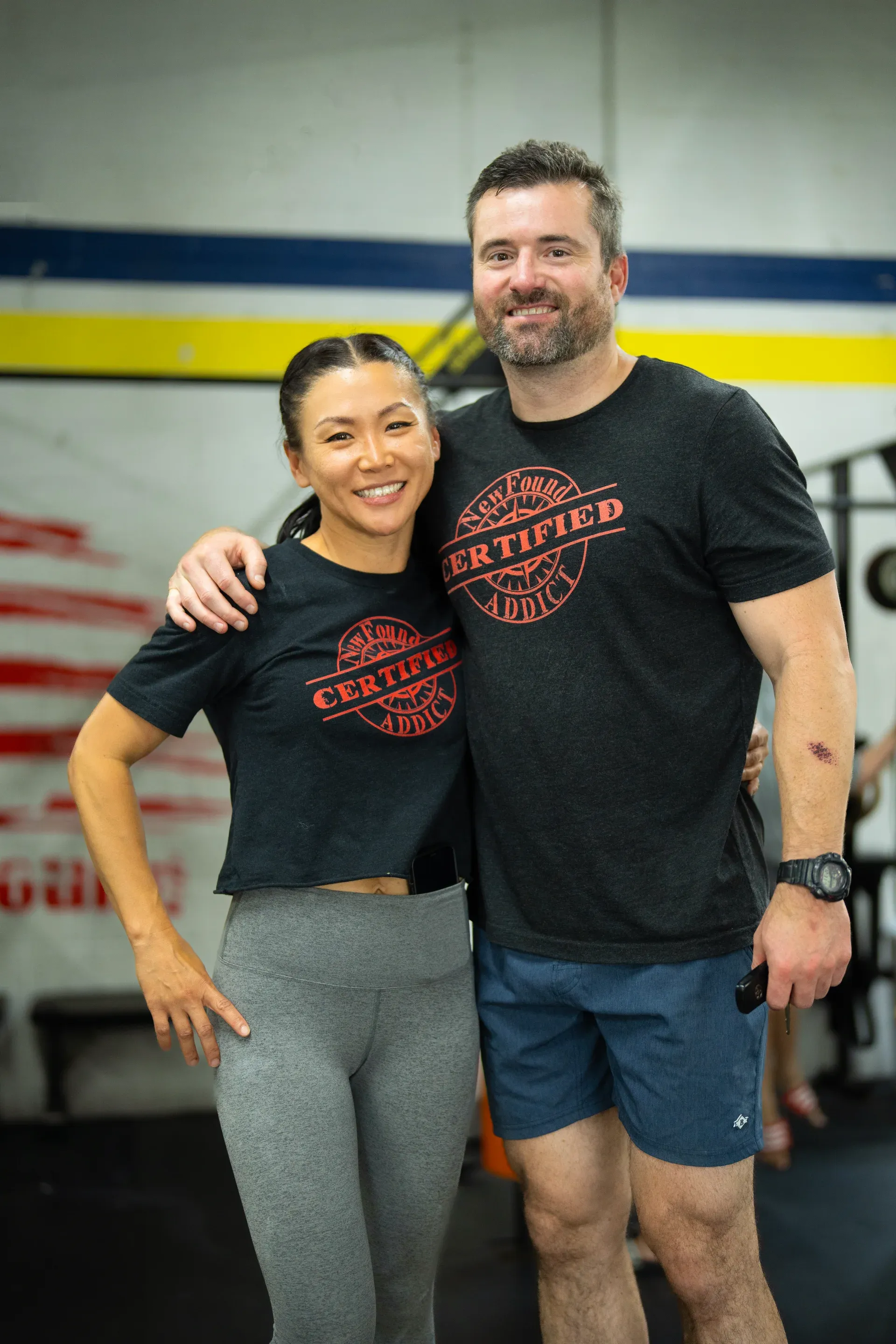 CrossFit NewFound members smiling together at the gym